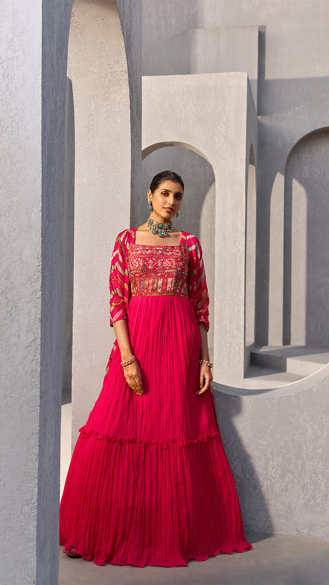 Women flaunting Ruby Red Floral Embroidered Crop Top Lehenga